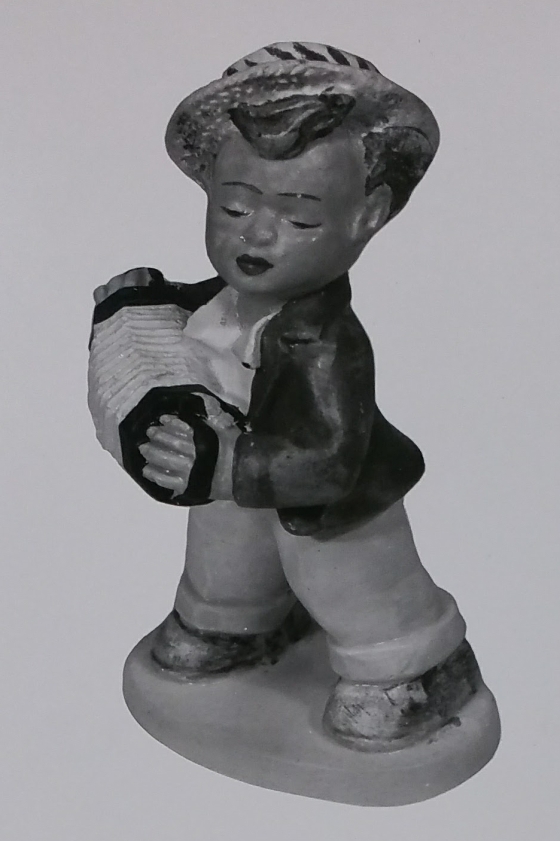 Accordion player figurine