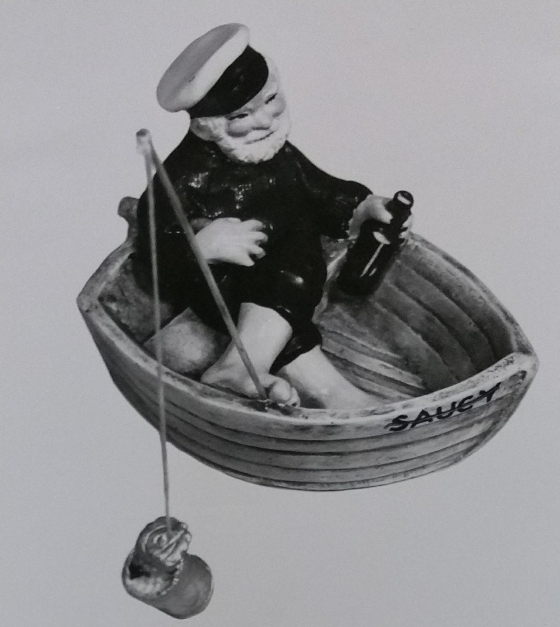 Sailor in boat figurine