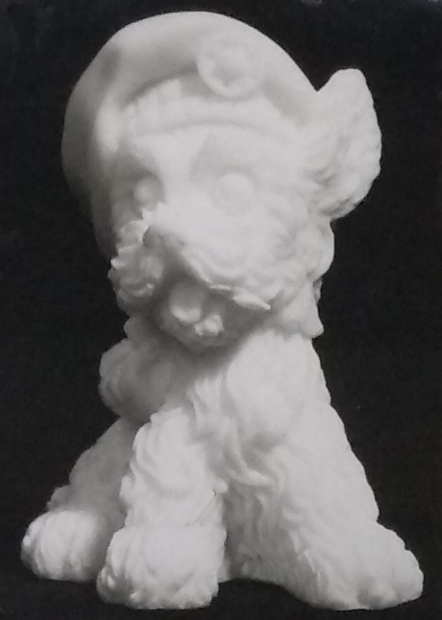 Raw chalkware dog statue