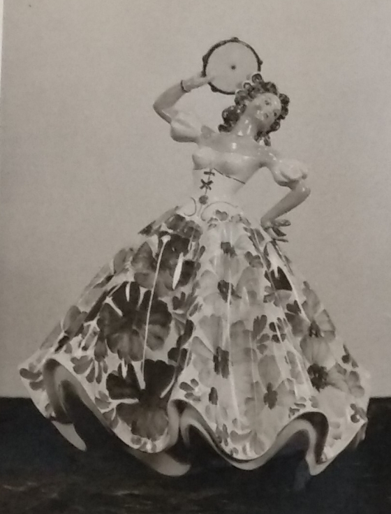 Lady figurine with large dress and tambourine