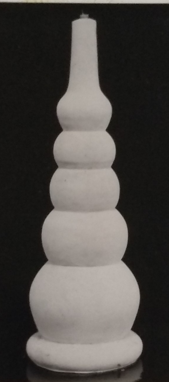 White standard lamp with 5 doughnut layers